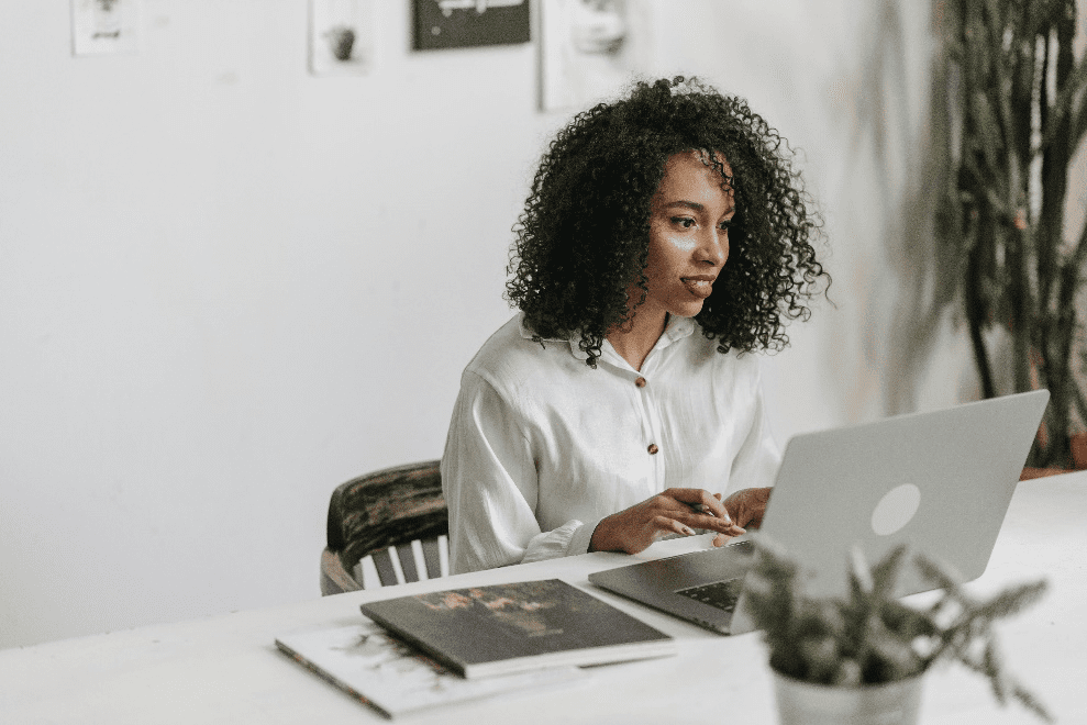Woman in a button-down calculating her finances