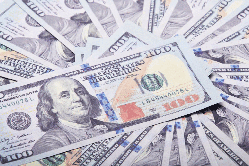 Close-up of dollar bills symbolizing real estate financing power