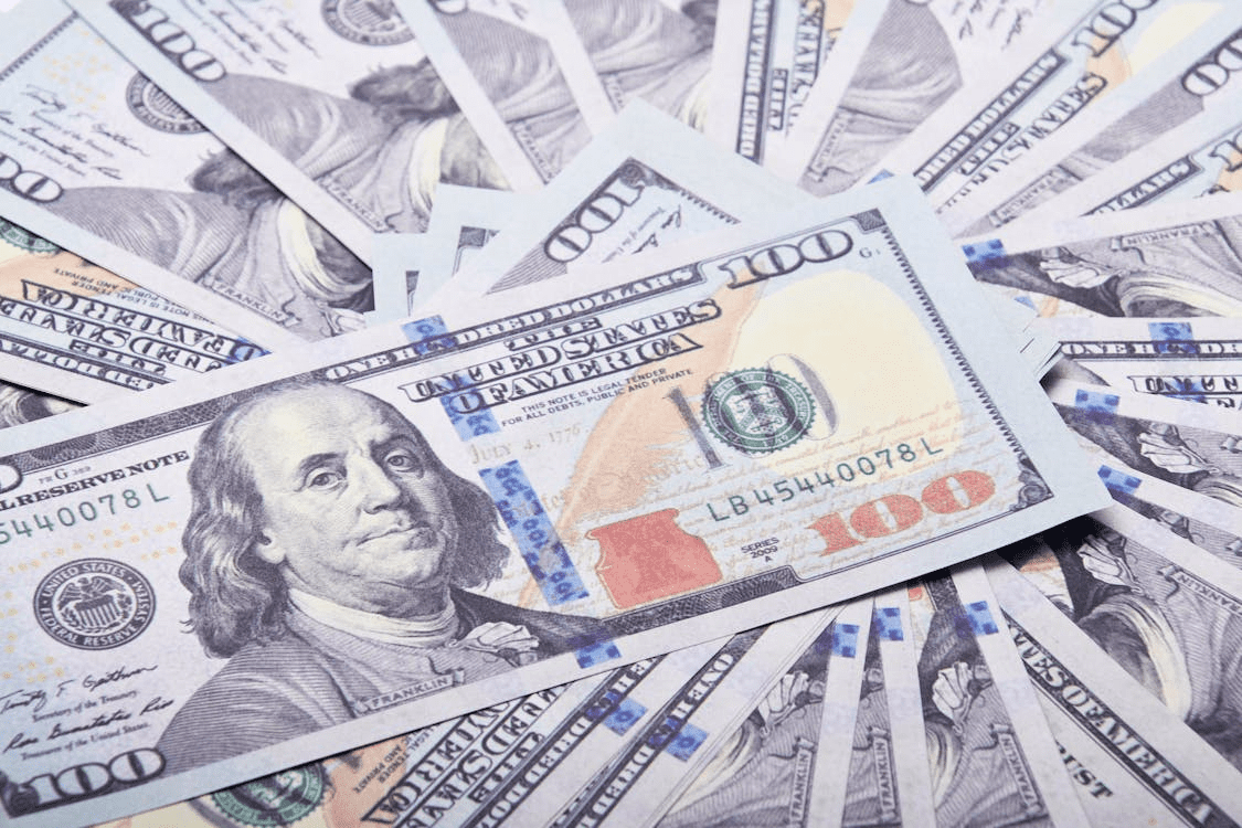 Close-up of dollar bills symbolizing real estate financing power