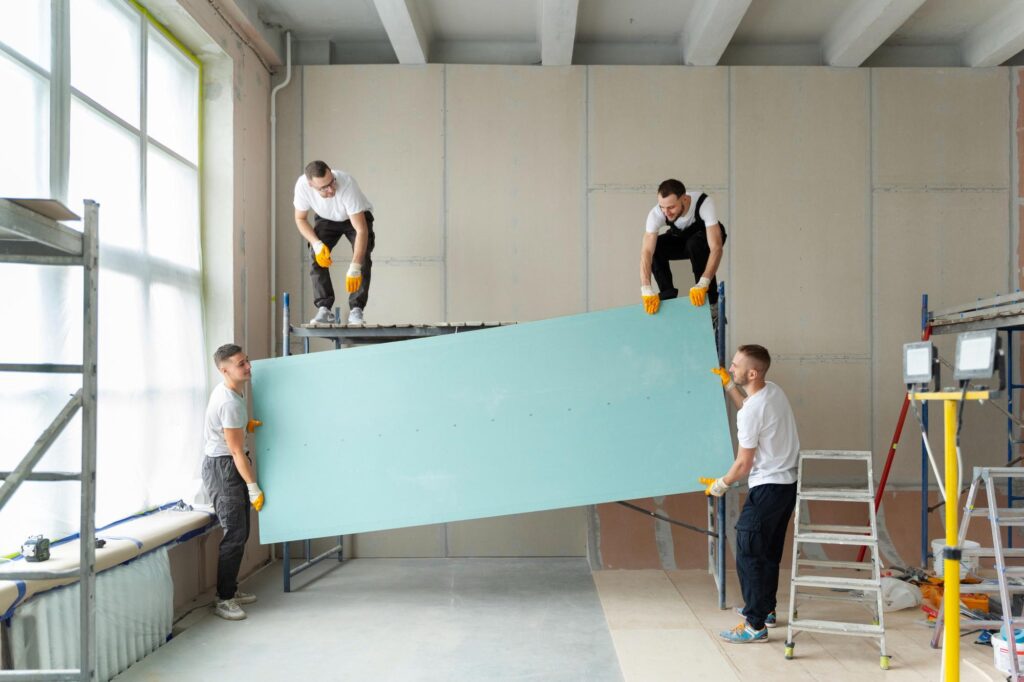 professionals working together to renovate a space