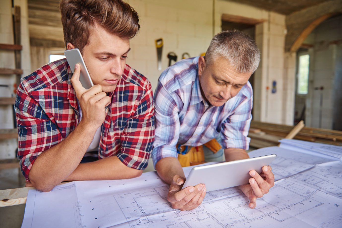 Real estate investor reviewing renovation plans for a flipped home in Charlotte, North Carolina