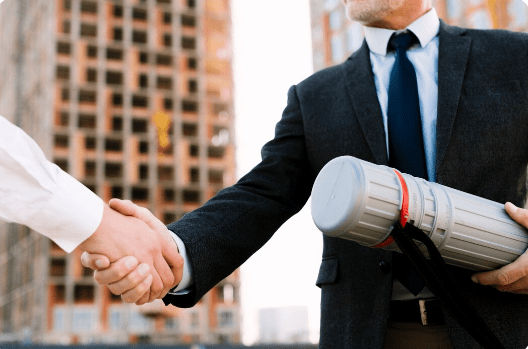  two individuals shaking hands post agreement