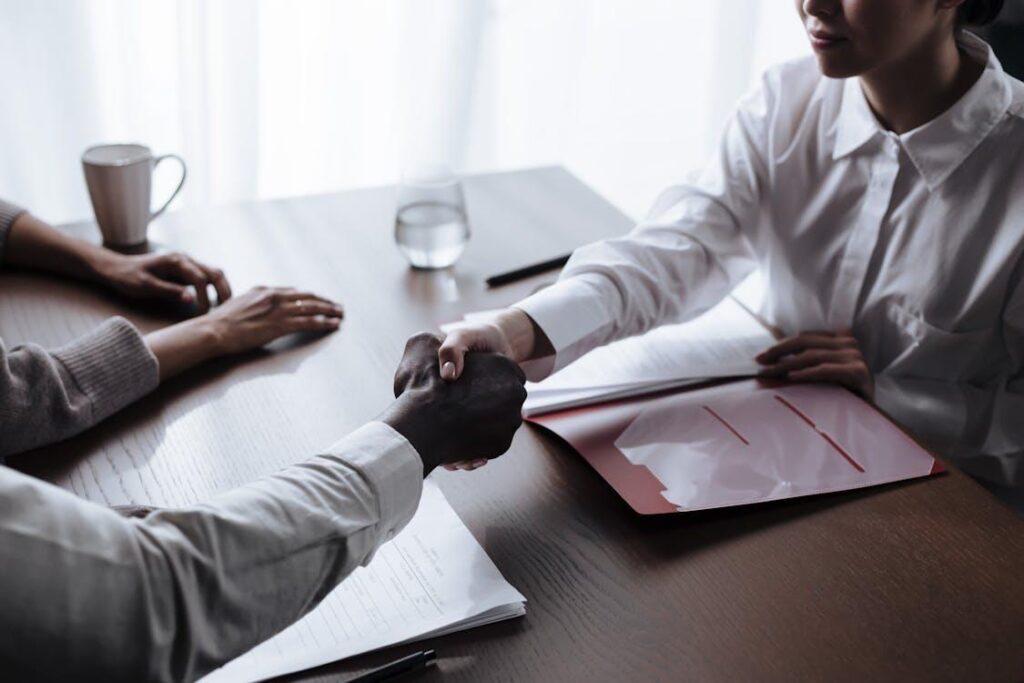 a client & lender shaking hands 