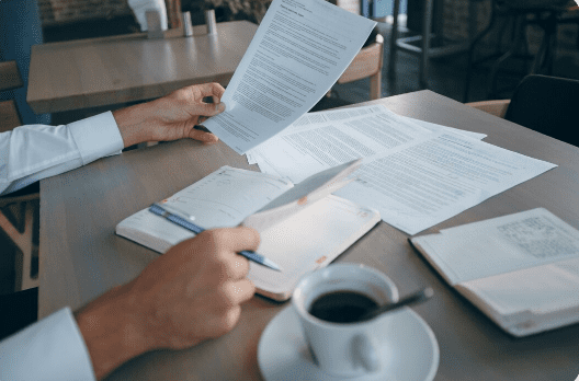 multiple documents scattered across a table