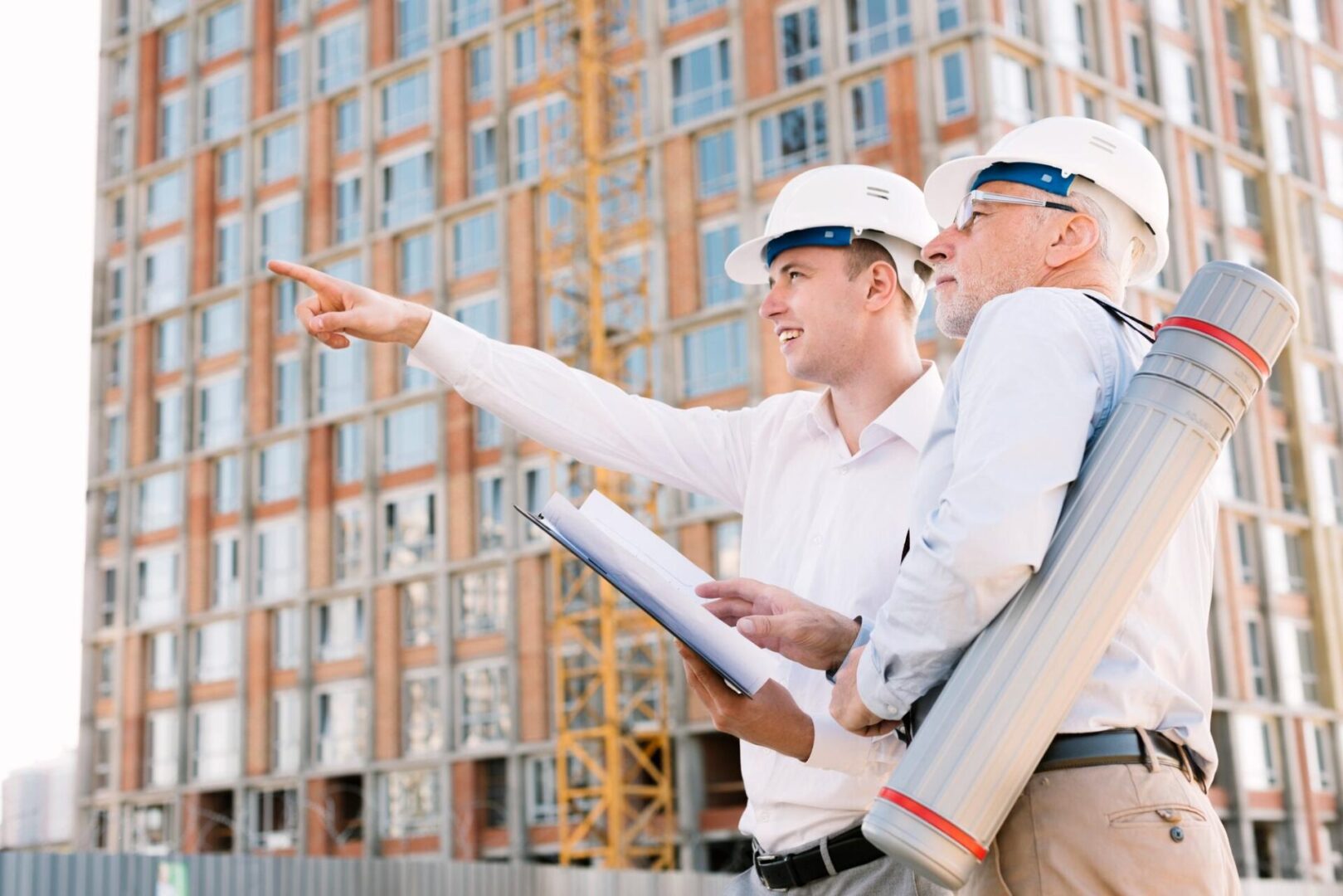 two engineers standing outside a new construction project