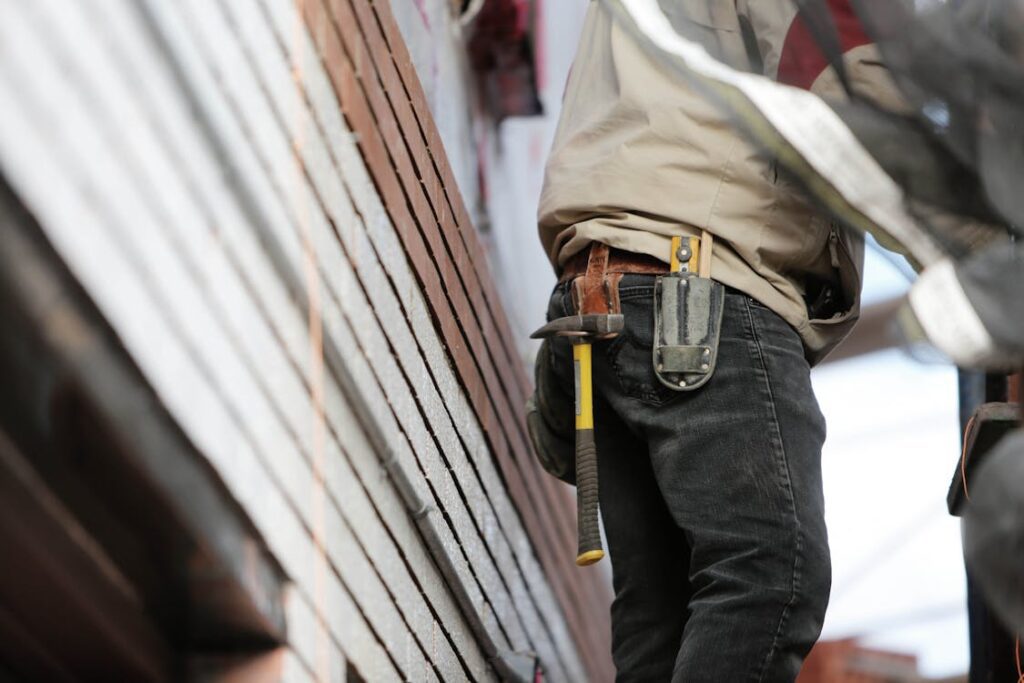 A person working with renovation tools.