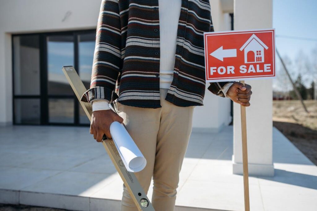 A person selling their house with floor plans and more.