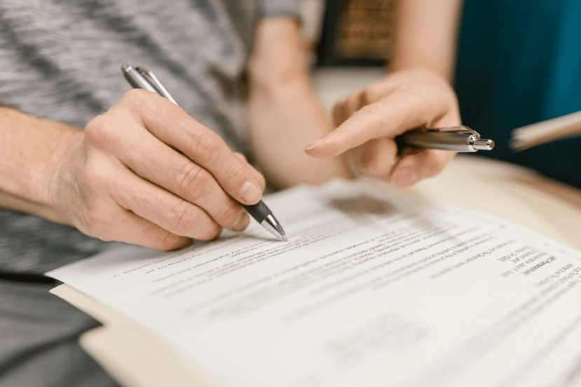 A person using cash-out refinancing to pay off debt