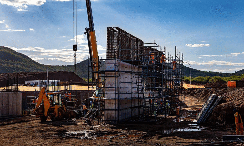  Road construction site with heavy machinery and workers keeping the project on track