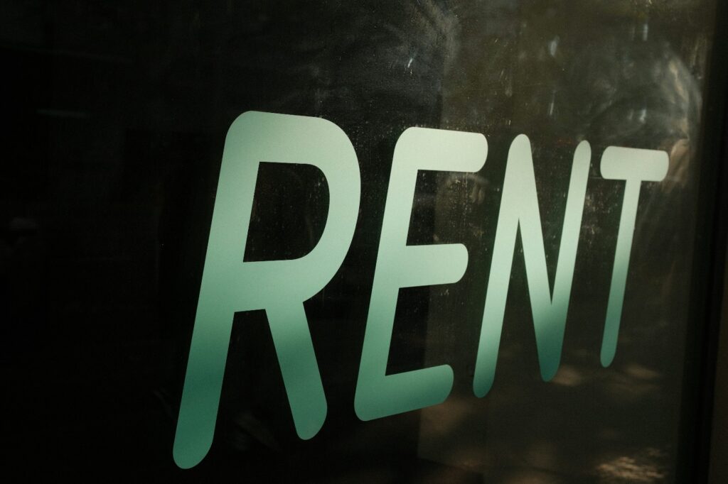 Close-up of a glass with rent written on it