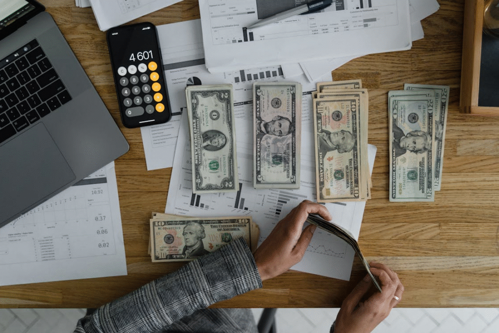 he image shows a person counting money while