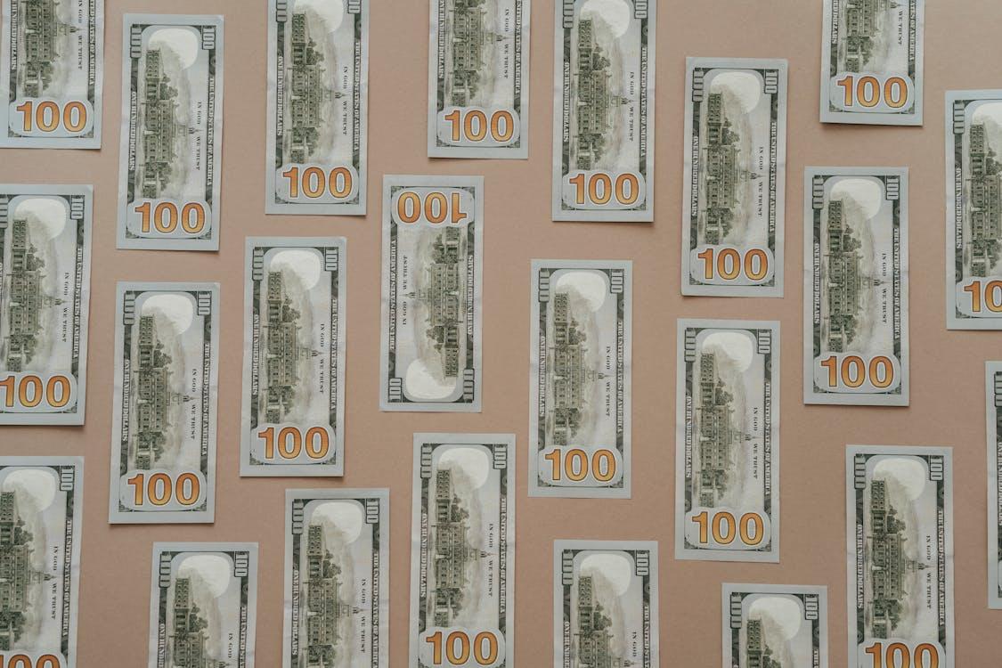 U.S. one-hundred-dollar bills laid out flat