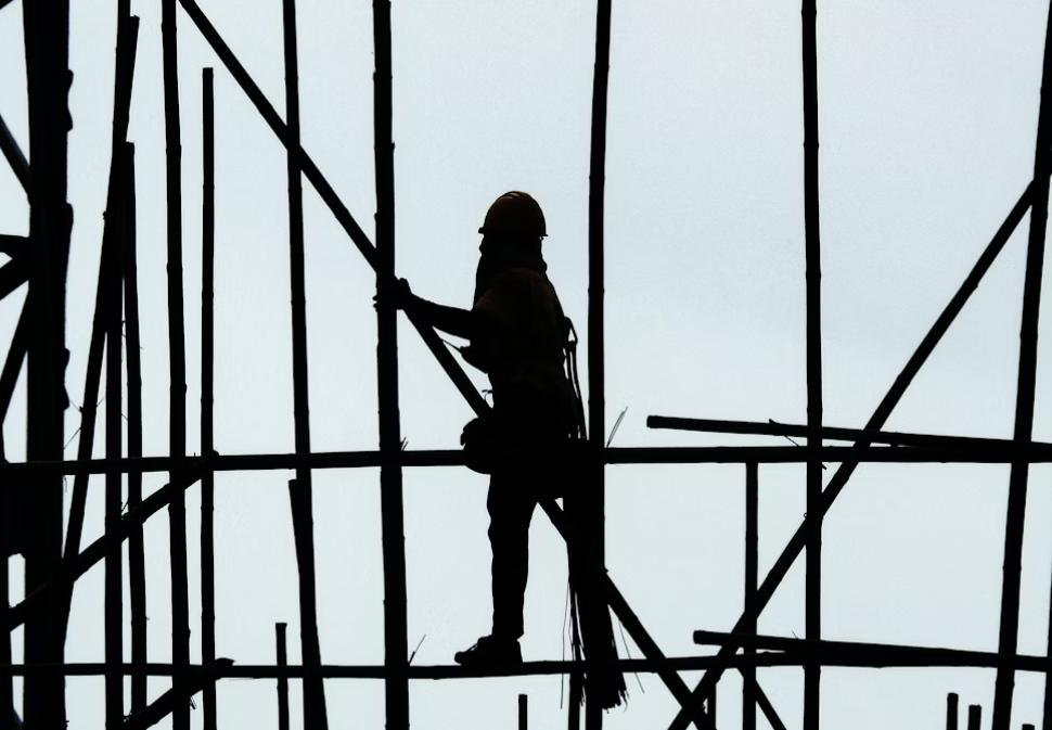 This image shows a man working on the construction side.