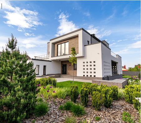 A large house with a huge landscaping garden