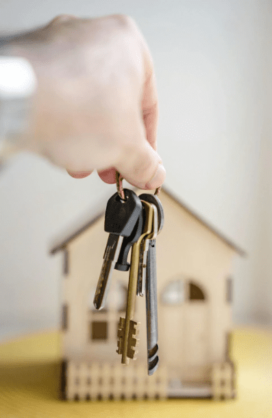 A homeowner holding their house keys.