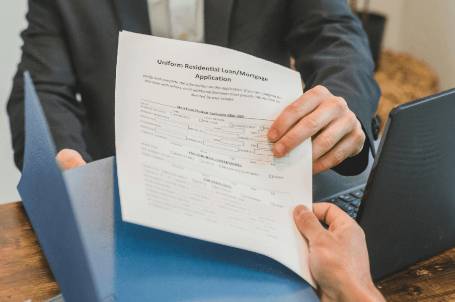  A person studying a loan application.