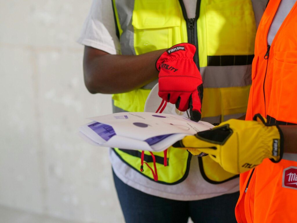 construction workers looking at a document