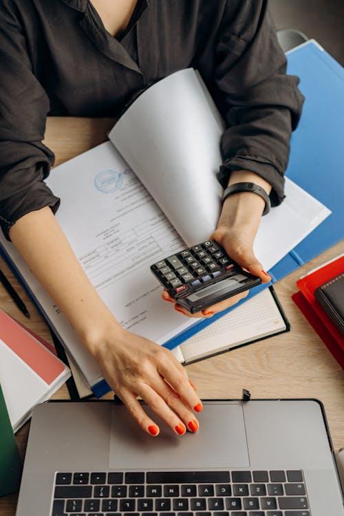 insurance document and calculator on a table