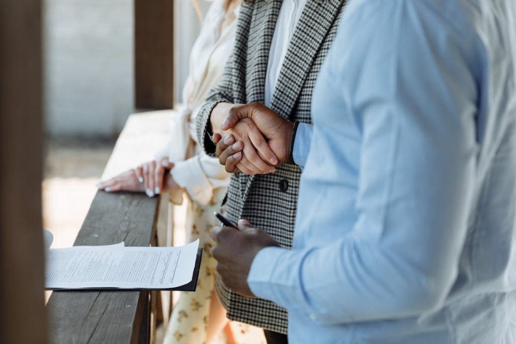 A lender and a client shaking hands
