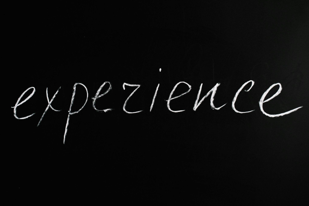 Chalkboard with the word experience written on it