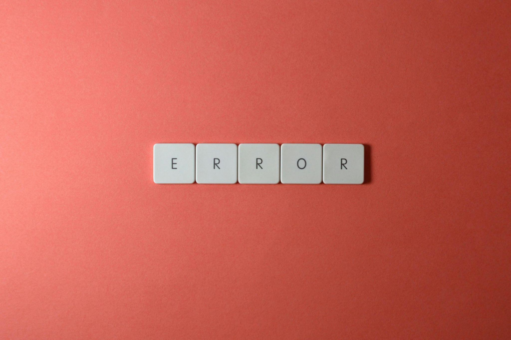 Keyboard keys spelling the word error on a red background