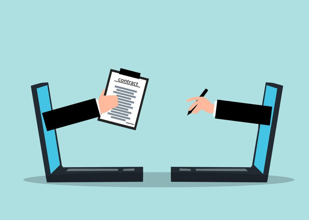Illustration of two mirrored laptops with hands coming out of their screens, one with a pen and the other with a contract, depicting fast online loan applications