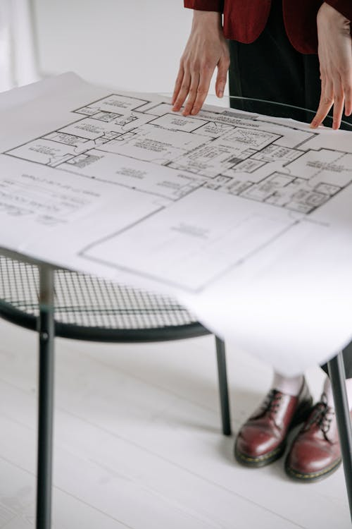 Investor reviewing a map with highlighted cities for real estate expansion
