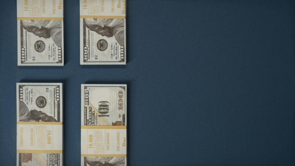 Stacks of US dollar bills secured with paper bands