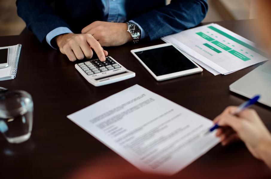 Real estate investor analyzing project budget and cash flow for a hard money loan approval