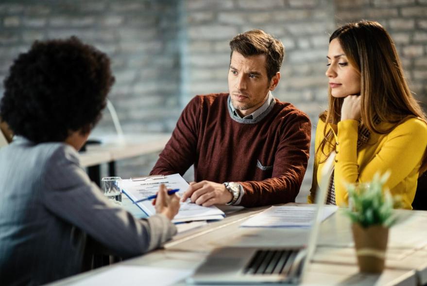 Borrower reviewing hard money loan documents and terms before signing to ensure favorable conditions