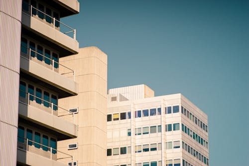 Apicture of two apartment buildings with balconies