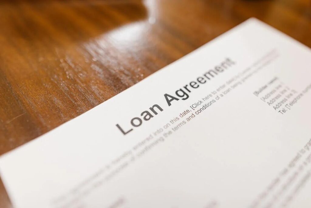 Close-up of a signed real estate financing agreement on paper