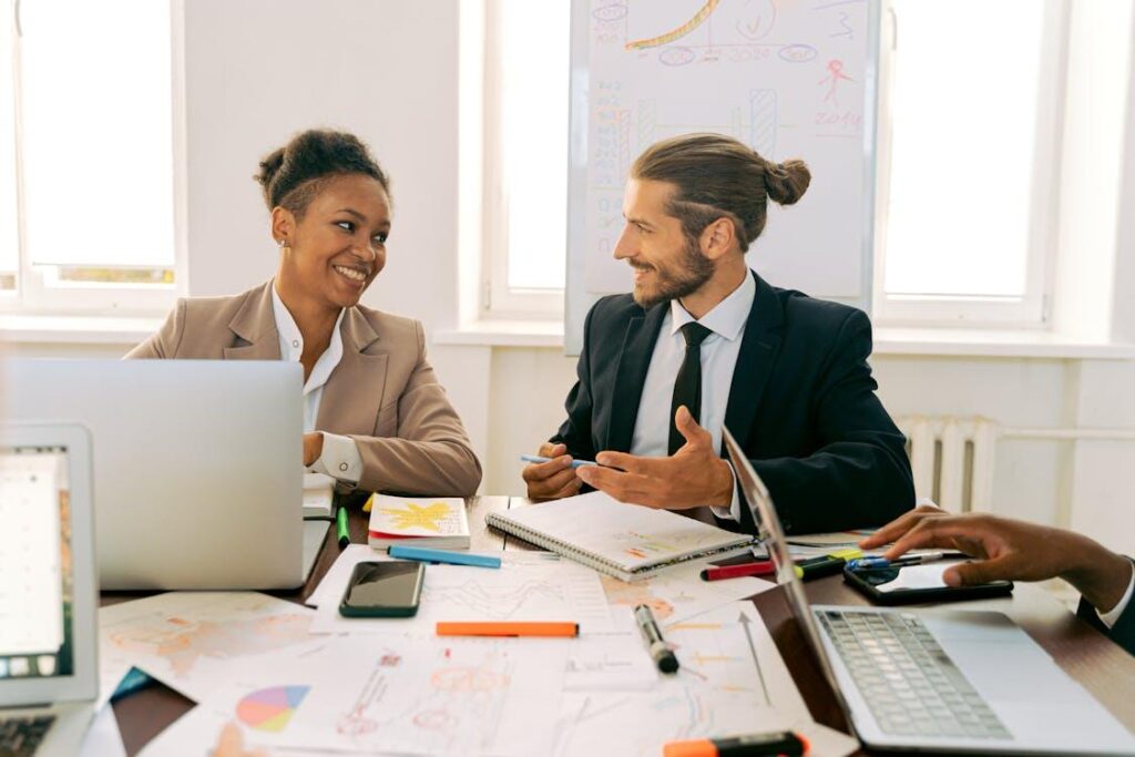 Real estate professionals reviewing multifamily investment financing plans