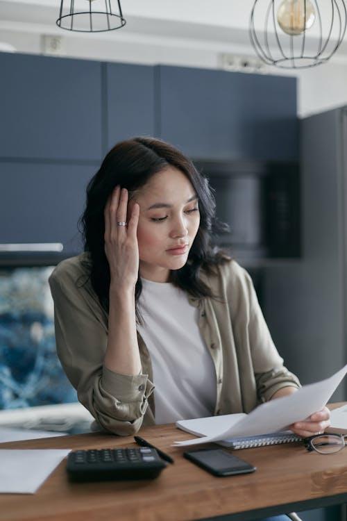 Woman reviewing credit and financial readiness for a multifamily bridge loan