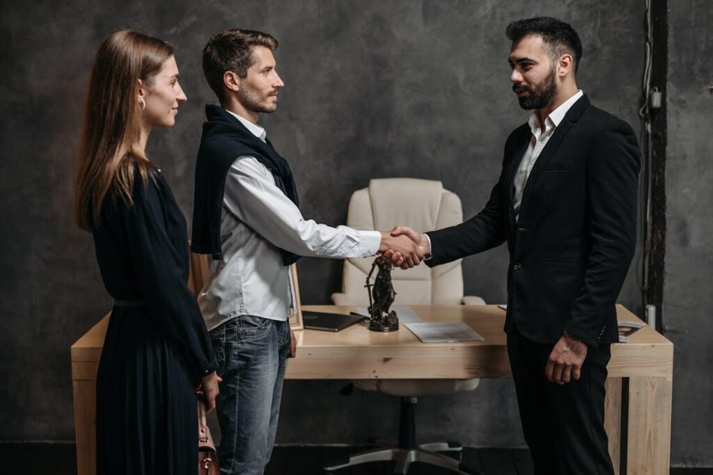 Investors and private lenders shaking hands during a meeting