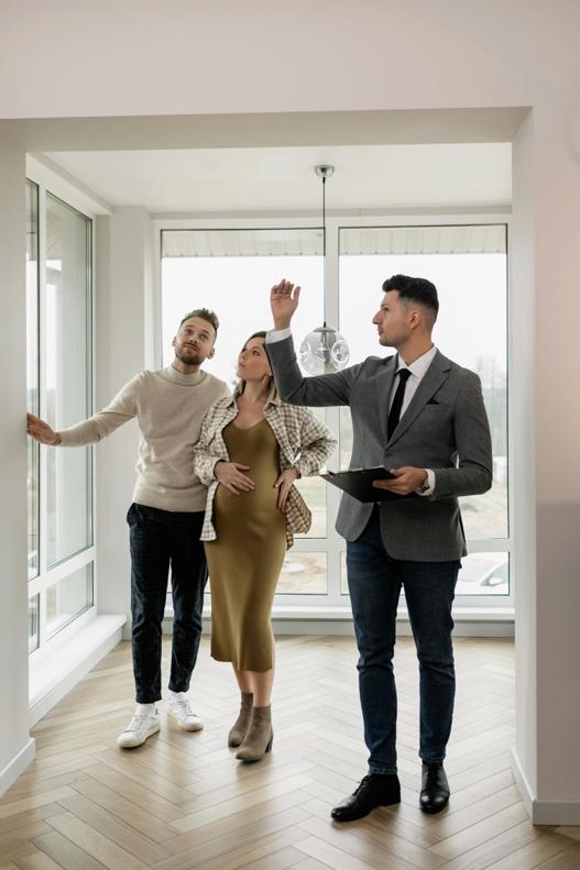 Real estate agent showing an investment property to a couple