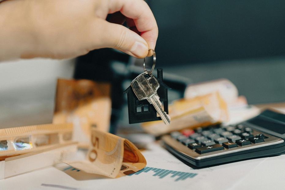 Keys and money exchanged during a rental property real estate transaction