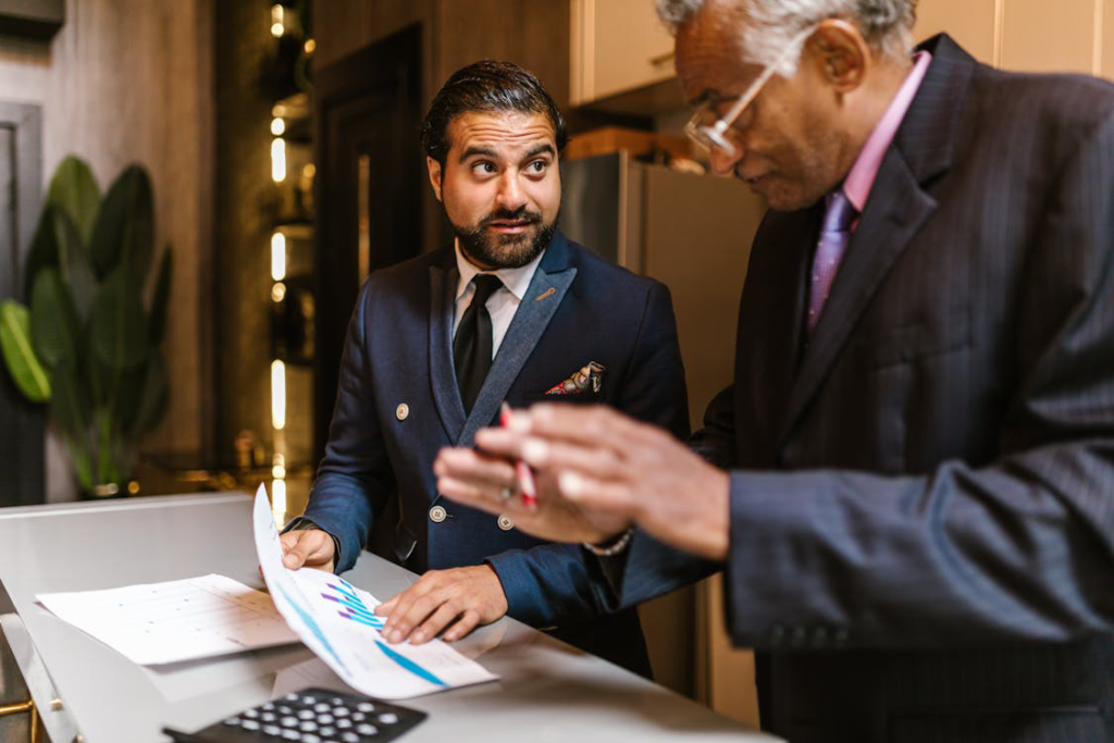 Real estate professionals reviewing financial documents during a bridge loan consultation