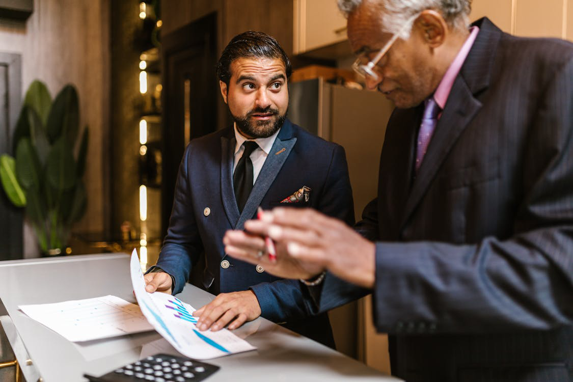 Real estate professionals reviewing financial documents during a bridge loan consultation