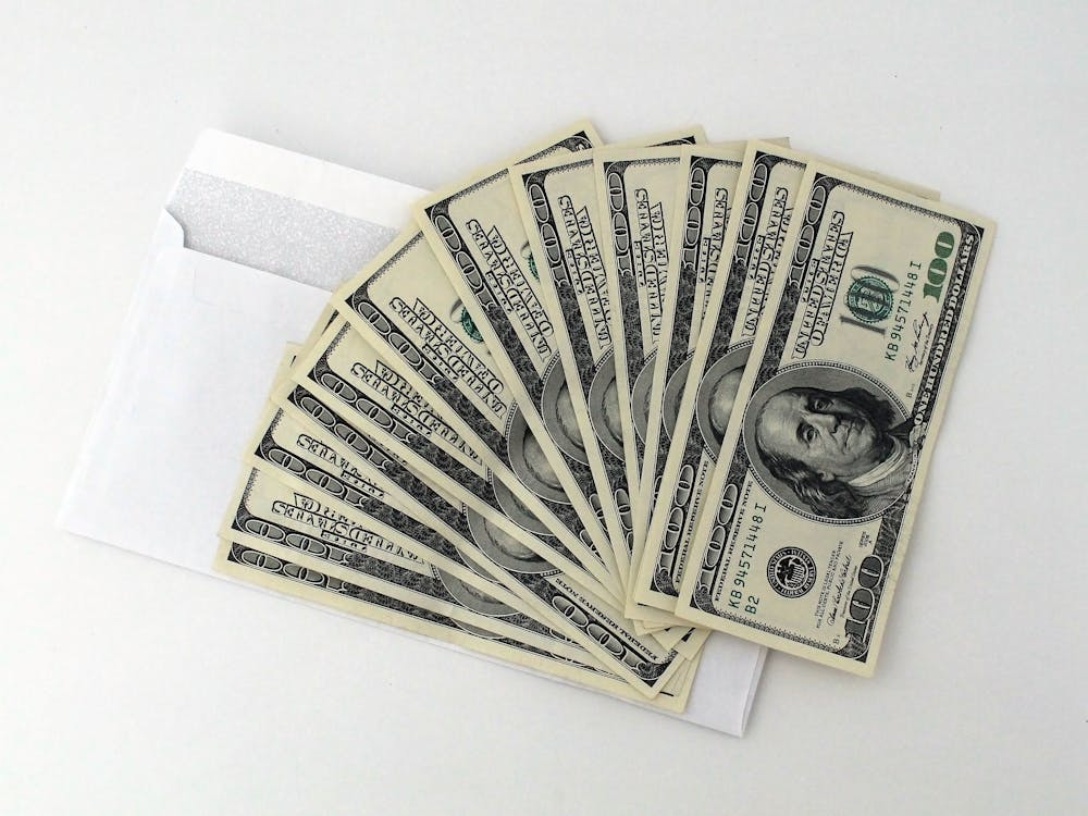 Hundred-dollar notes on an envelope