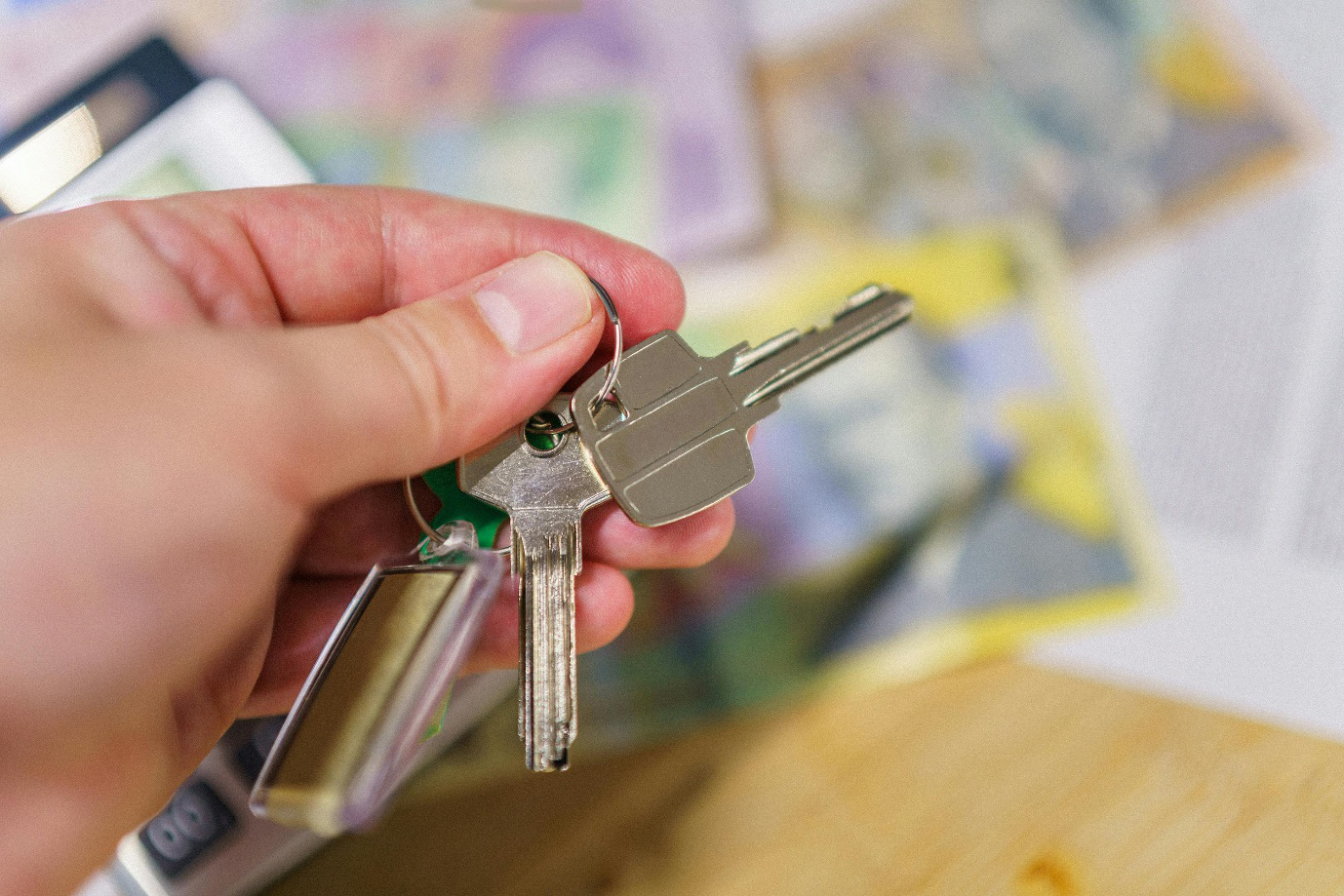 A photo showing a hand holding keys