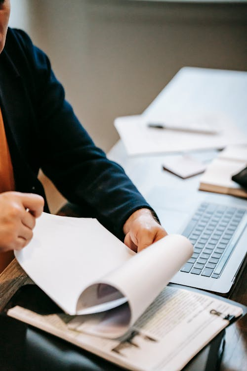 An image of a person flipping pages