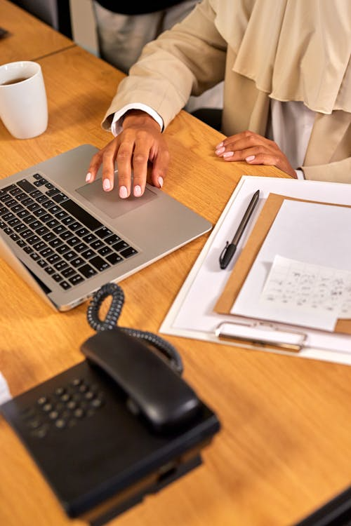 An image of a person working on a laptop
