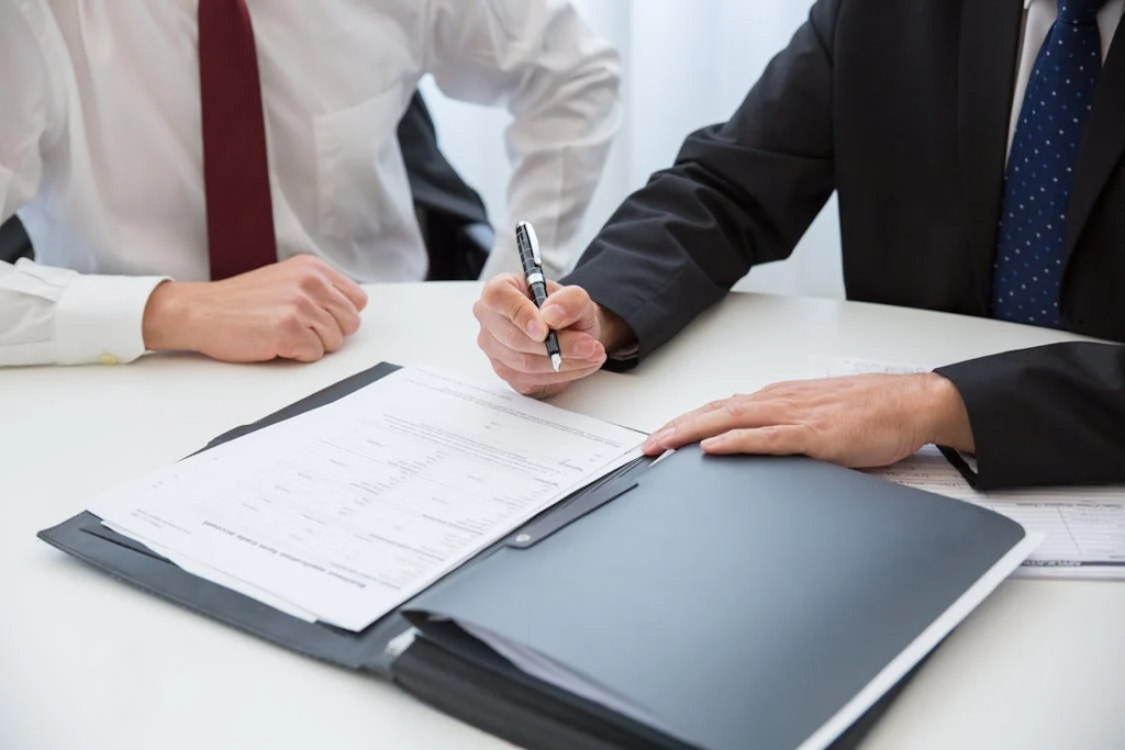 An image of a person signing papers     