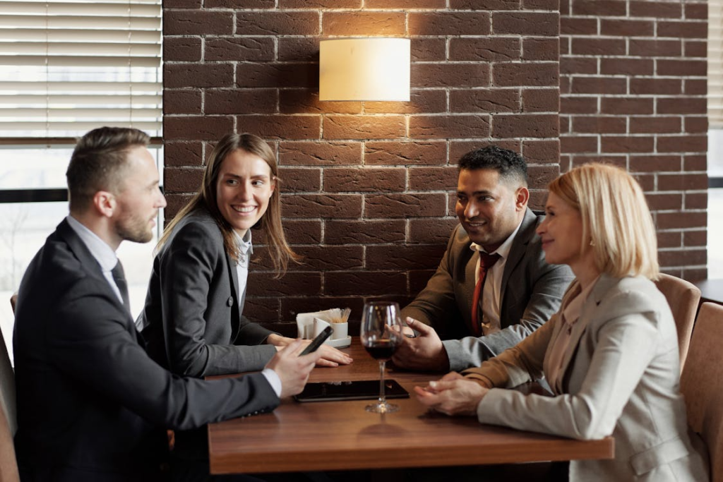 An image of coworkers talking in a café