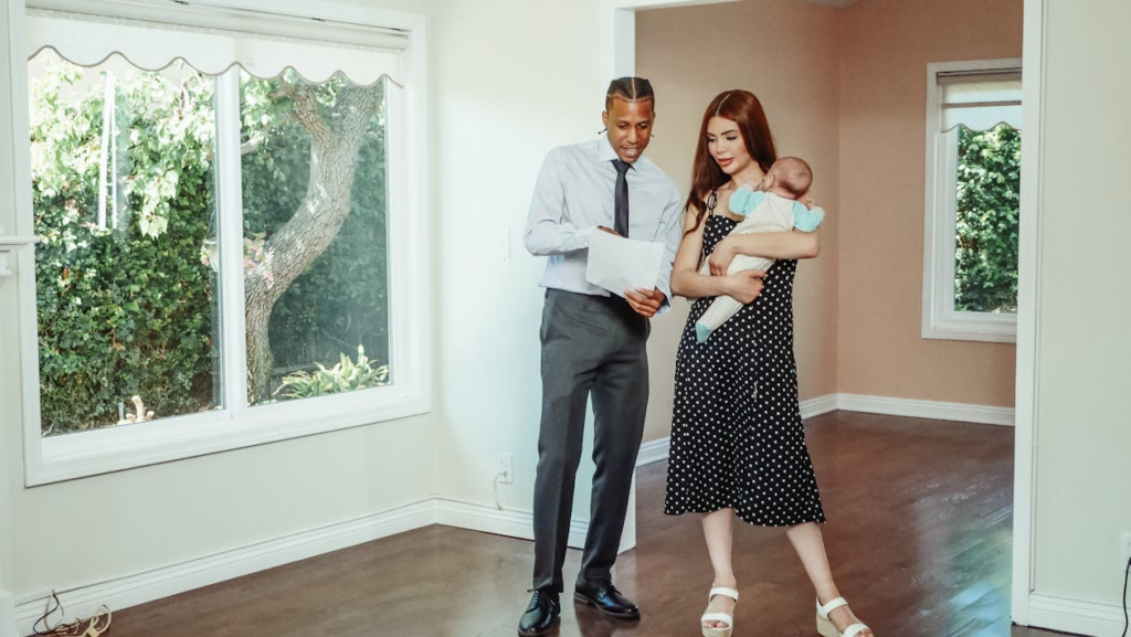 Couple reviewing property offer documents during rental investment process