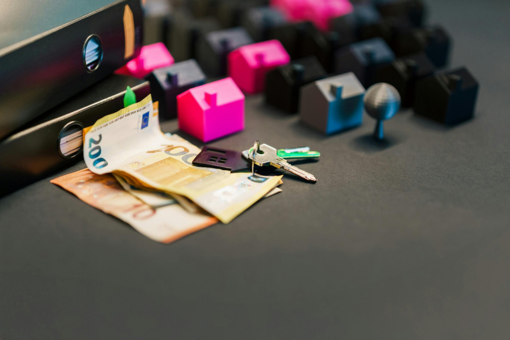 A photo showing keys placed next to miniature home models
