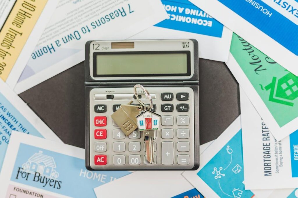 a calculator with house keys on it
