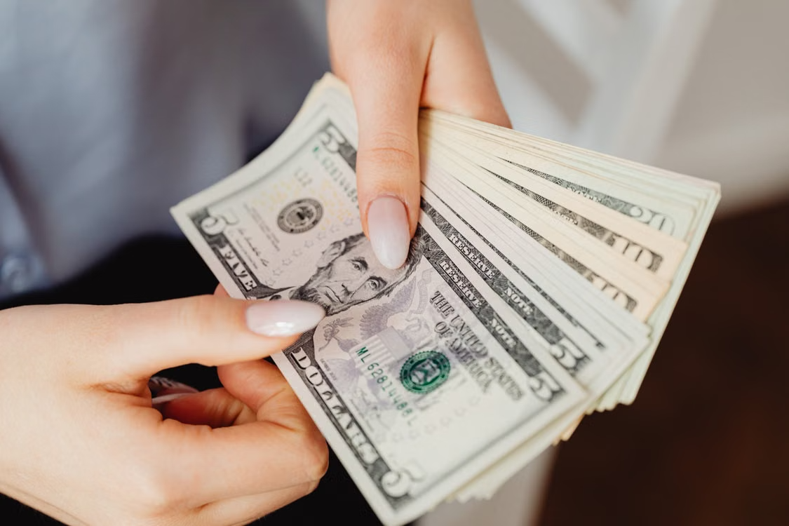 close-up of a person counting cash