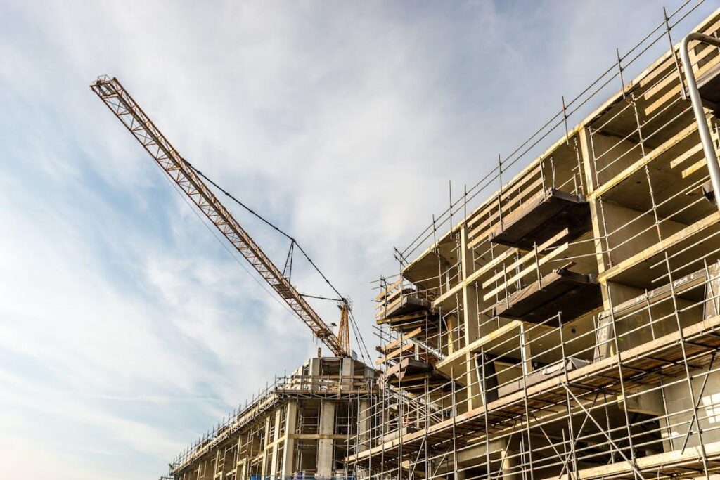 A crane next to a building under construction